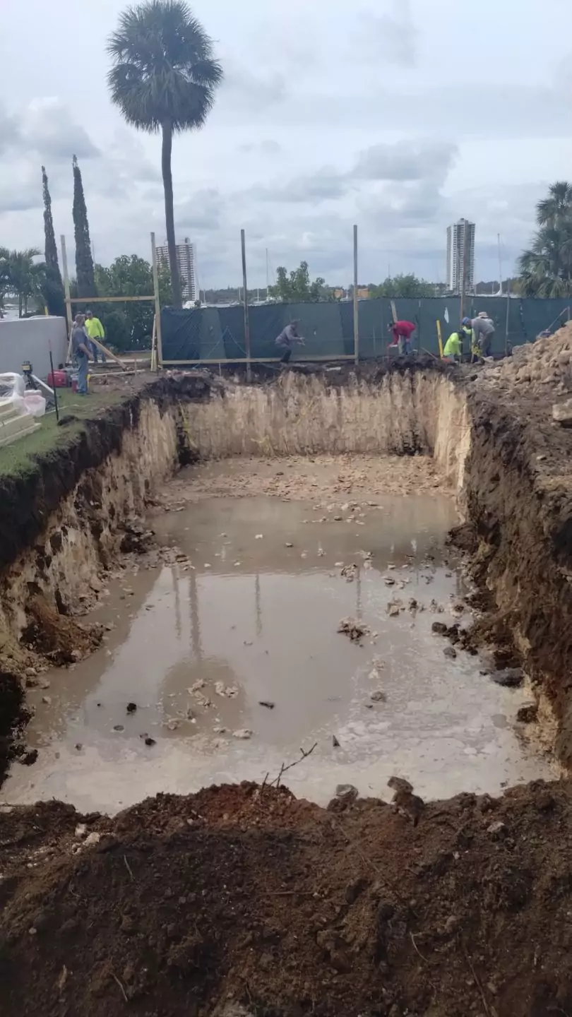 Excavating for a pool in hard pan rock